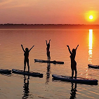 Paddelboarders doing yoga
